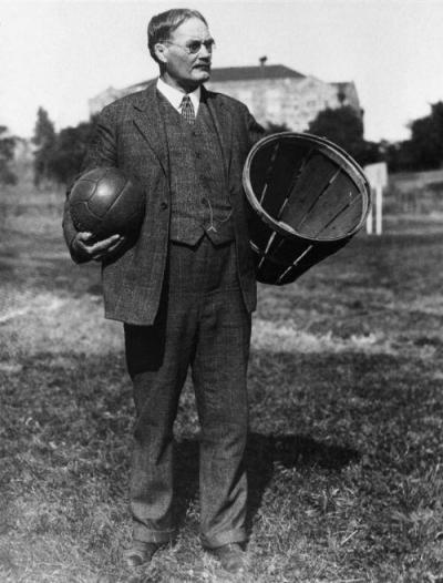 Dr James Naismith with peach basket and ball