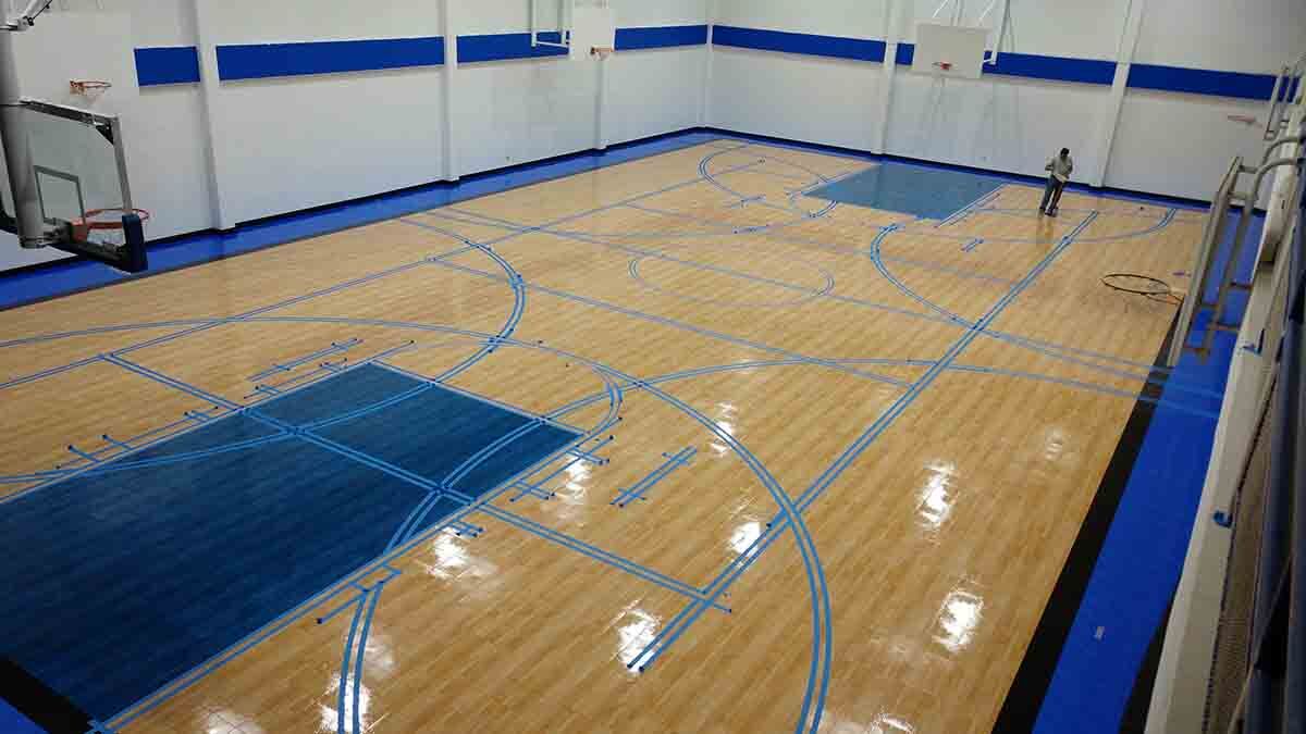 Painter's tape in methodically and perfectly laid before game lines are painted.