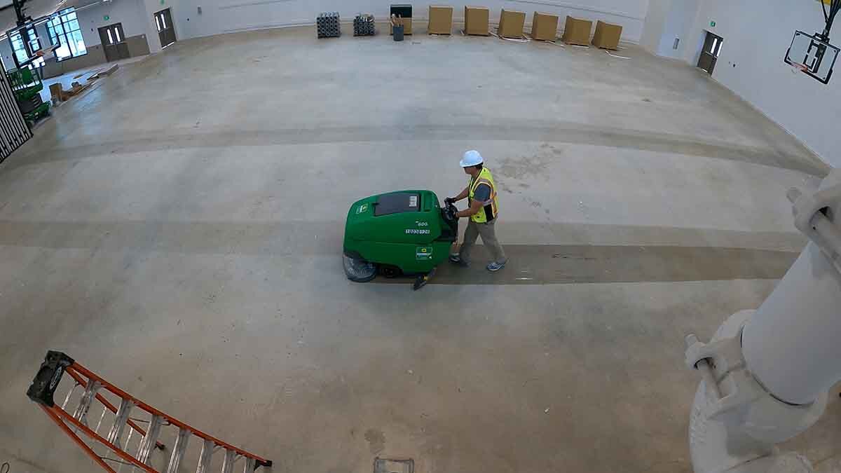 Cleaning concrete with automatic floor scrubber
