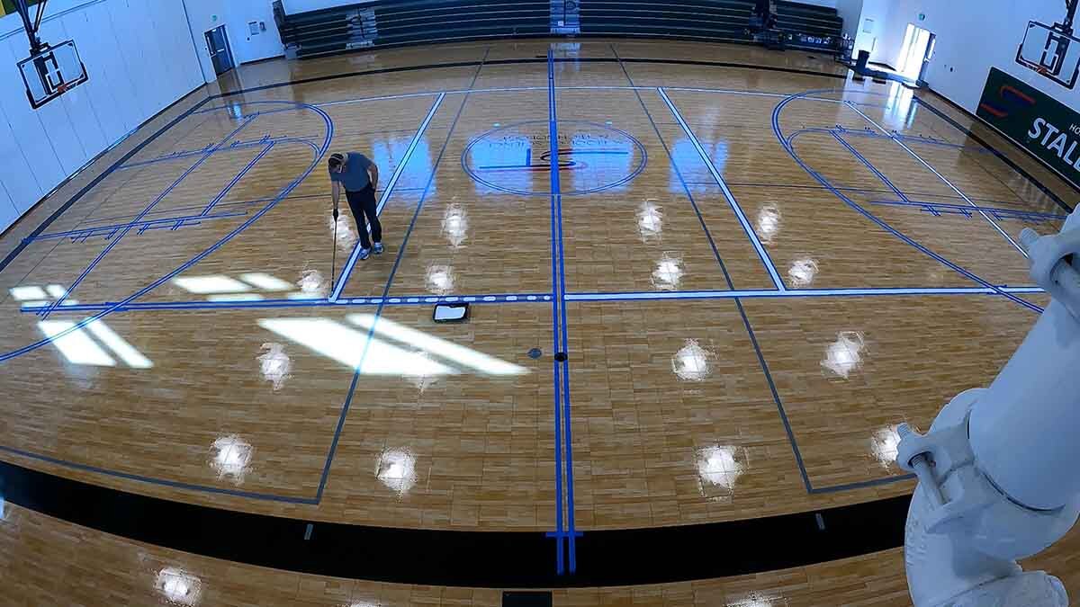 Painting game lines on Sport Court® gym floor