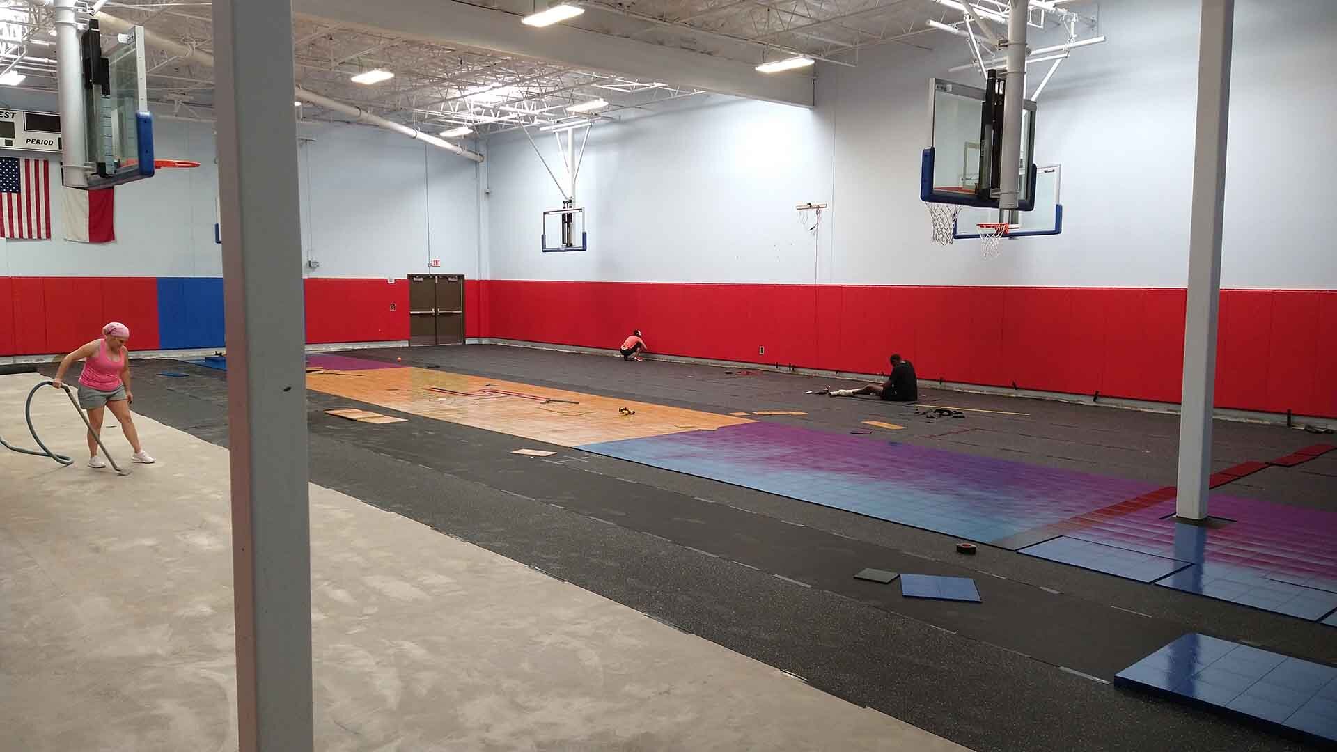 Preparation for Sport Court athletic flooring installation.