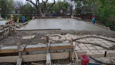 Pouring concrete for a pickleball court in San Antonio
