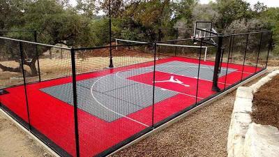 Net fence around half court basketball court in Boerne, Texas
